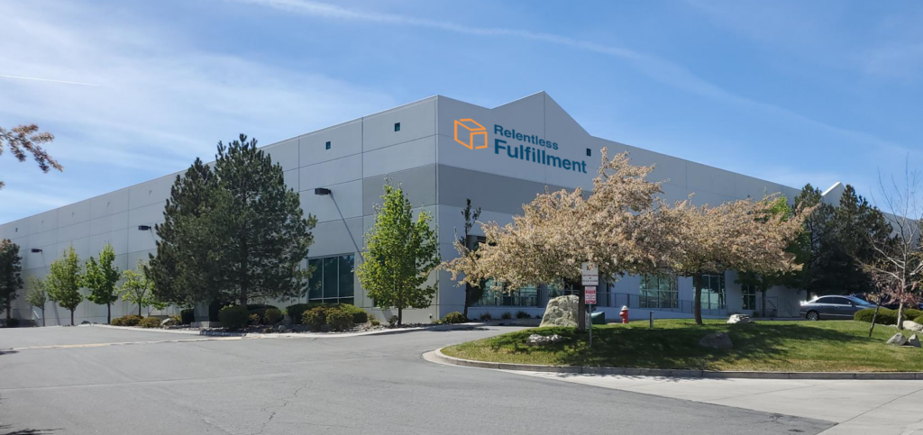 The Relentless Fulfillment facility, surrounded by trees.